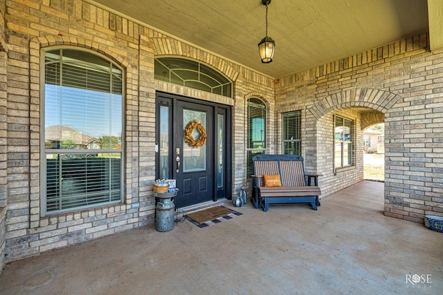 doorway to property featuring covered porch