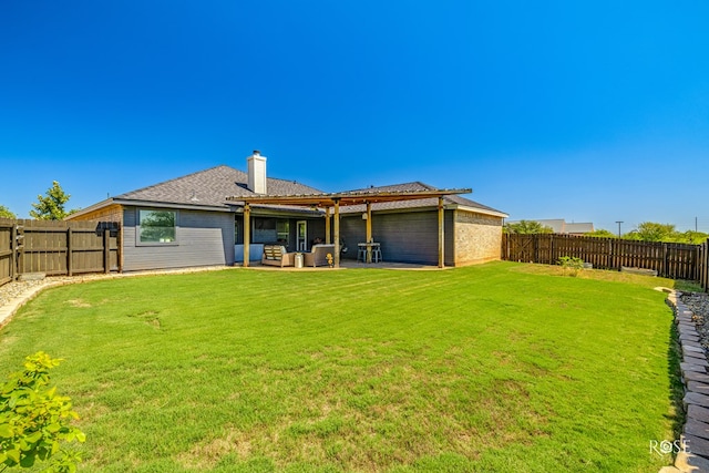 back of property featuring outdoor lounge area, a yard, and a patio area