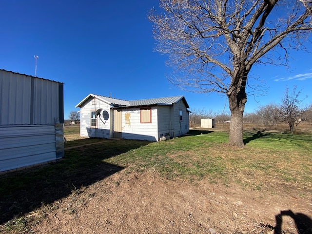 view of property exterior featuring a yard