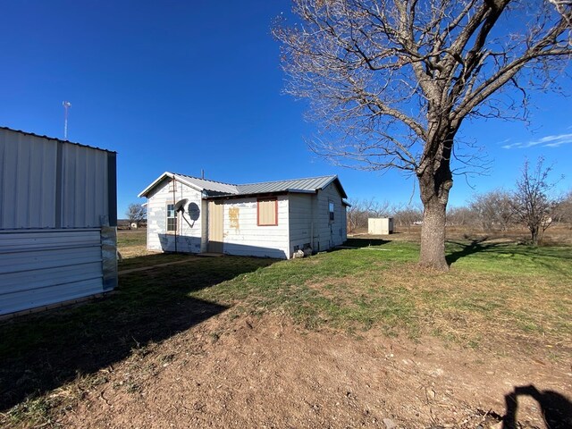 view of property exterior featuring a yard