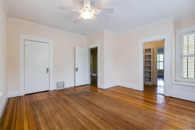 unfurnished bedroom with wood-type flooring, ornamental molding, and ceiling fan