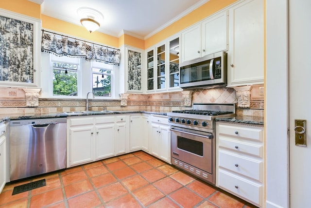 kitchen featuring white cabinetry, appliances with stainless steel finishes, and sink