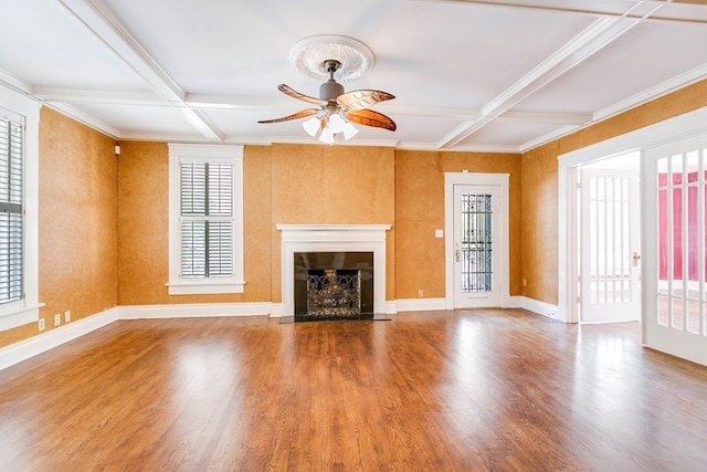 unfurnished living room with hardwood / wood-style flooring, coffered ceiling, and beam ceiling