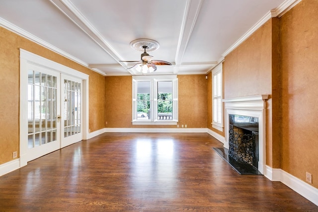 unfurnished living room featuring dark wood-type flooring, ceiling fan, coffered ceiling, a fireplace, and french doors