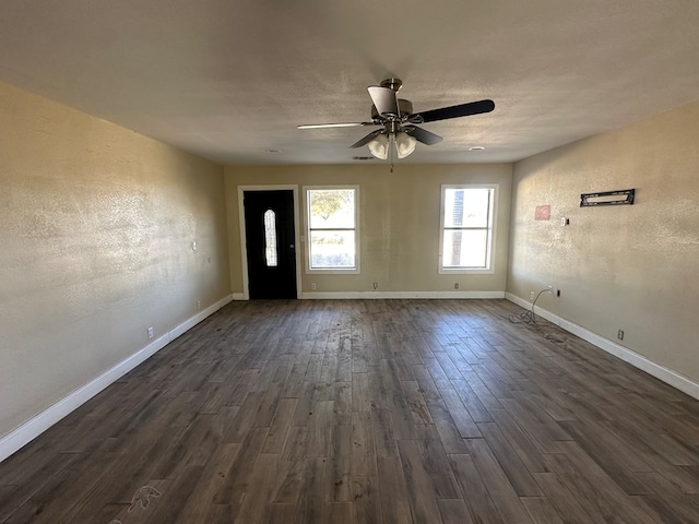 entrance foyer with a textured ceiling, dark hardwood / wood-style floors, and ceiling fan