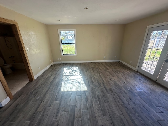 spare room featuring dark hardwood / wood-style floors