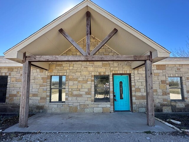 property entrance with a patio