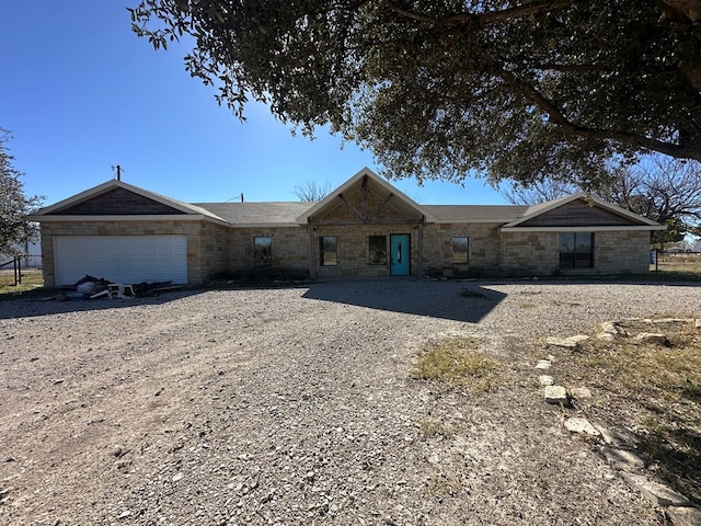 single story home featuring a garage