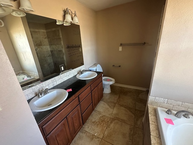 bathroom featuring tasteful backsplash, a bathing tub, vanity, and toilet