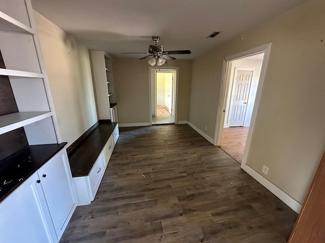 hallway featuring dark wood-type flooring