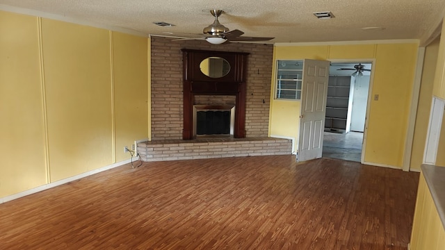 unfurnished living room with visible vents, a ceiling fan, and wood finished floors