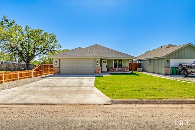 ranch-style home featuring a garage and a front yard