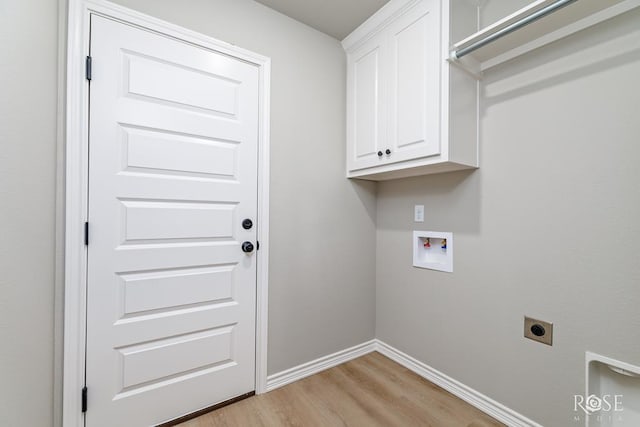 laundry area featuring cabinets, electric dryer hookup, washer hookup, and light wood-type flooring