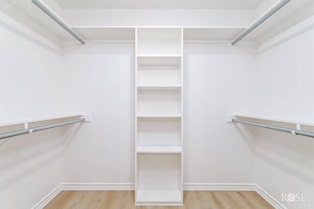 walk in closet featuring light wood-type flooring