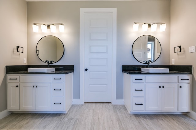 bathroom featuring vanity and hardwood / wood-style floors