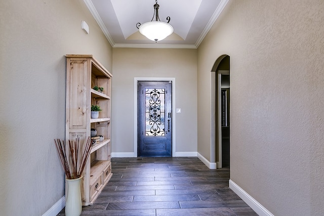 entrance foyer featuring crown molding and lofted ceiling