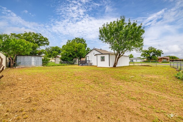 935 E 40th St, San Angelo, TX 76903 - fenced backyard with a storage unit