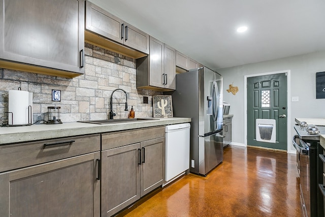 718 E 45th St, San Angelo, TX 76903 - kitchen with stainless steel appliances, backsplash, concrete flooring, light stone counters, and recessed lighting