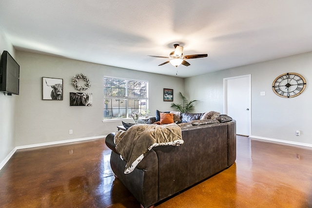 718 E 45th St, San Angelo, TX 76903 - living room with concrete floors and a ceiling fan