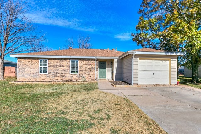 718 E 45th St, San Angelo, TX 76903 - ranch-style house featuring a garage, a front yard, brick siding, and concrete driveway