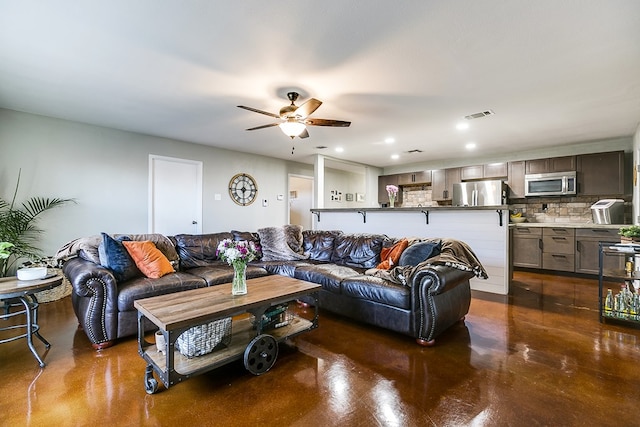 718 E 45th St, San Angelo, TX 76903 - living area featuring finished concrete flooring, ceiling fan, and recessed lighting