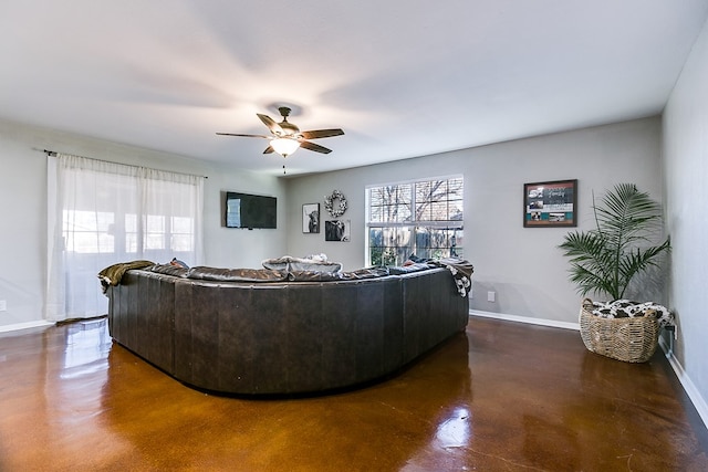 718 E 45th St, San Angelo, TX 76903 - living area featuring finished concrete flooring and ceiling fan