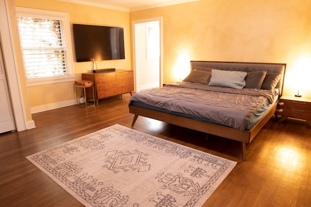 1510 Shafter St, San Angelo, TX 76901 - bedroom with ornamental molding, dark wood-style flooring, and baseboards