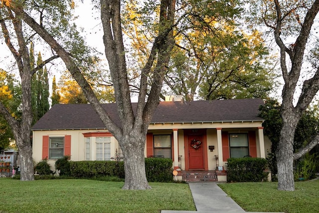 1510 Shafter St, San Angelo, TX 76901 - ranch-style house featuring a shingled roof, a front yard, and stucco siding
