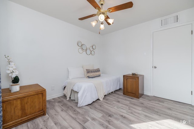 286 Mockingbird Ln, San Angelo, TX 76901 - bedroom featuring light wood-style floors, a ceiling fan, and baseboards