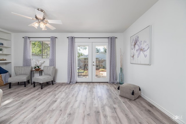 286 Mockingbird Ln, San Angelo, TX 76901 - sitting room featuring french doors, wood finished floors, a ceiling fan, baseboards, and built in shelves