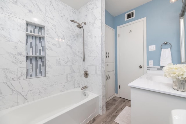 286 Mockingbird Ln, San Angelo, TX 76901 - full bath featuring wood finished floors, shower / washtub combination, and vanity