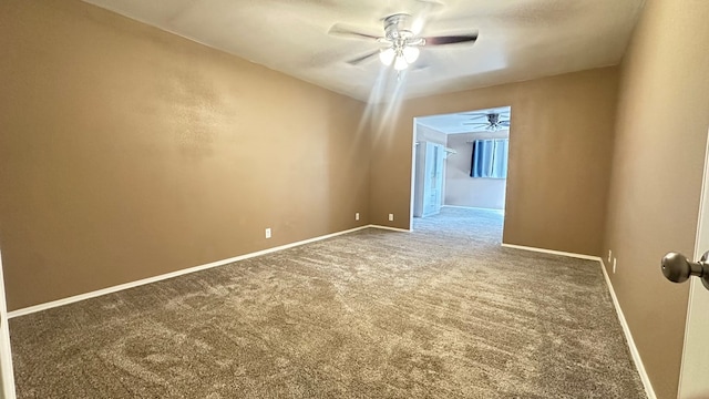 carpeted empty room with ceiling fan