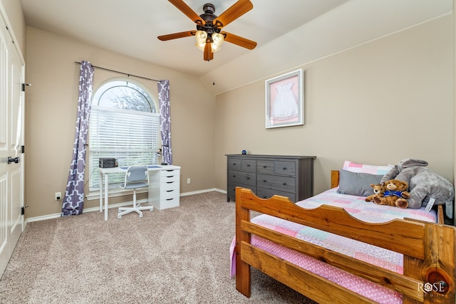 carpeted bedroom with vaulted ceiling and ceiling fan