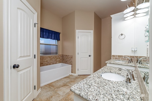 bathroom with vanity and a tub