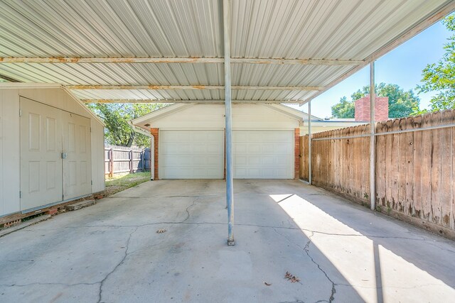 garage featuring a carport