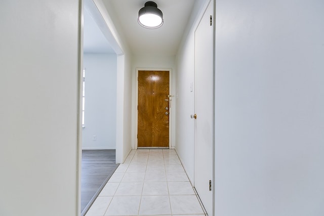 hallway featuring light tile patterned flooring