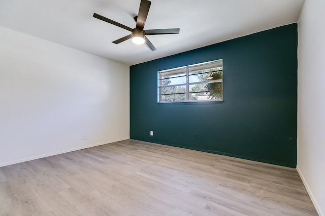 empty room with light hardwood / wood-style floors and ceiling fan