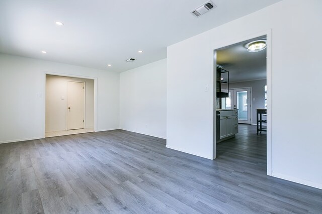 empty room with wood-type flooring