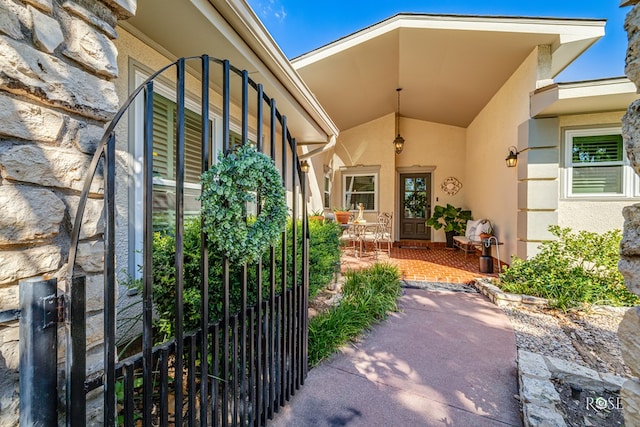 property entrance featuring a patio