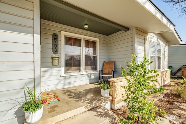 doorway to property with a porch