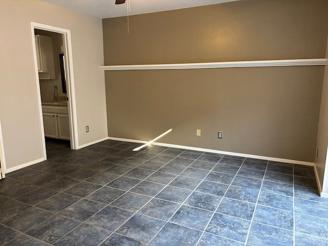 spare room featuring ceiling fan