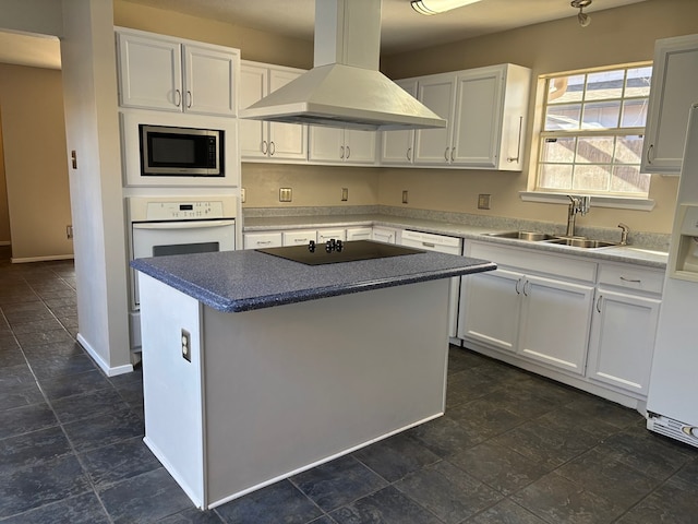 kitchen featuring white cabinetry, a center island, and island exhaust hood