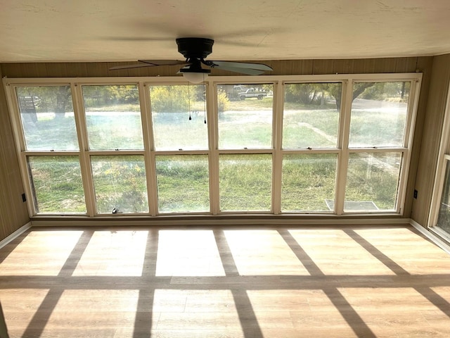 unfurnished sunroom with plenty of natural light