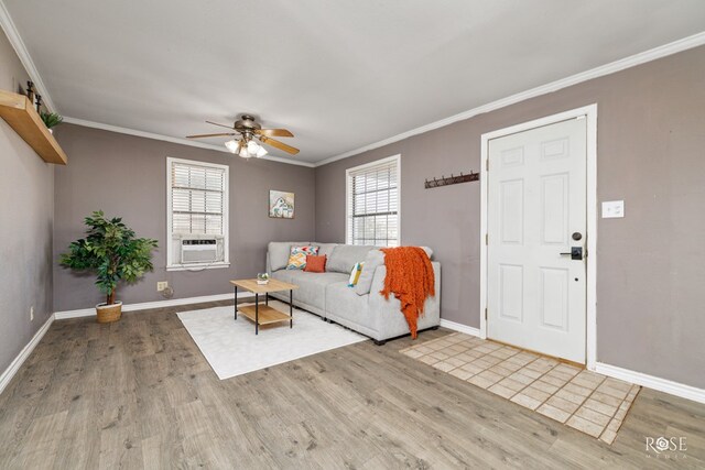 unfurnished living room featuring cooling unit, ceiling fan, ornamental molding, and light hardwood / wood-style floors