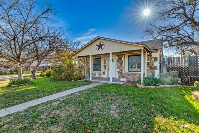 bungalow-style house featuring a porch and a front lawn