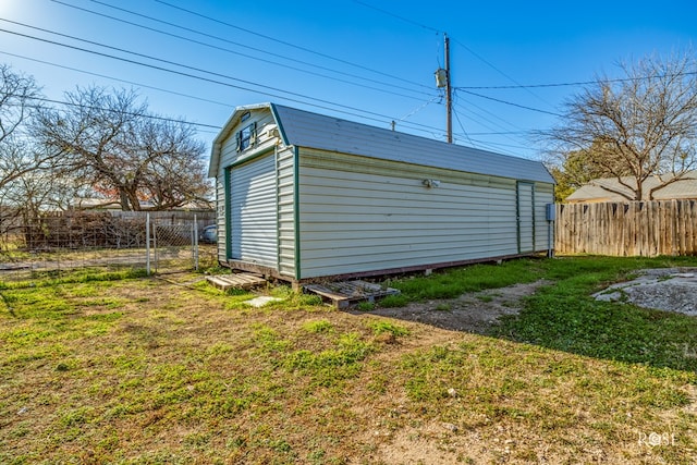 view of outbuilding with a yard