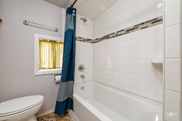 bathroom featuring toilet and shower / bath combo