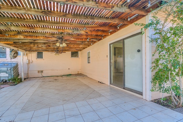 view of patio / terrace with a ceiling fan and a pergola