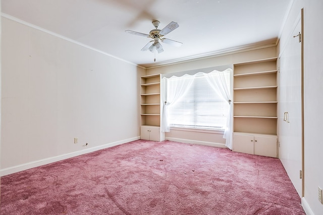 unfurnished bedroom with ornamental molding, light carpet, baseboards, and a ceiling fan