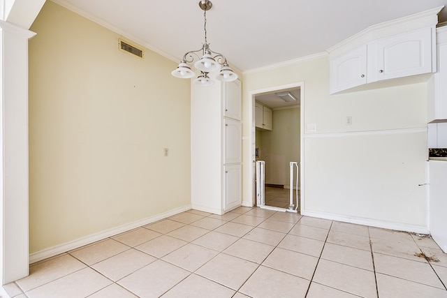 unfurnished dining area featuring light tile patterned floors, crown molding, visible vents, baseboards, and an inviting chandelier